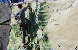 Man Using a Rock Climbing Wall Play Structure